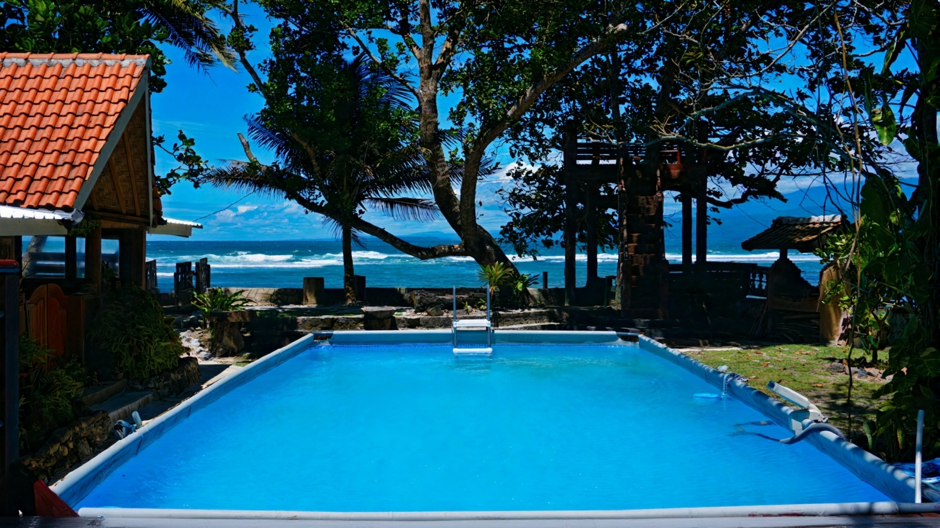 Swimming pool area at Krui Surf Camp beachfront